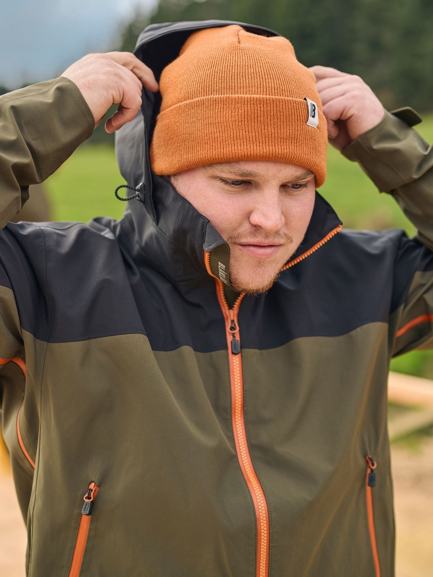 Tradesman wearing Blaklader Workwear Cascade 3 Layer Shell Jacket