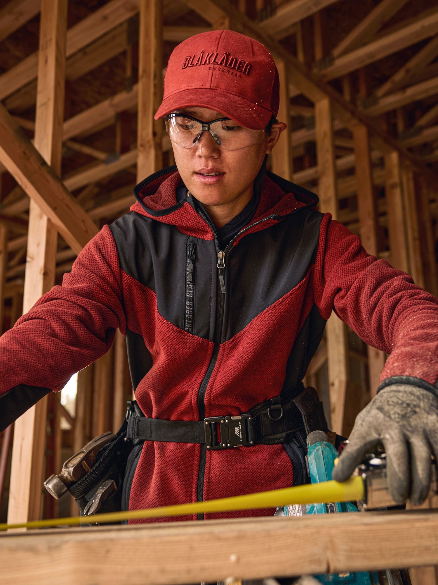 Female construction worker wearing Blaklader workwear on a jobsite