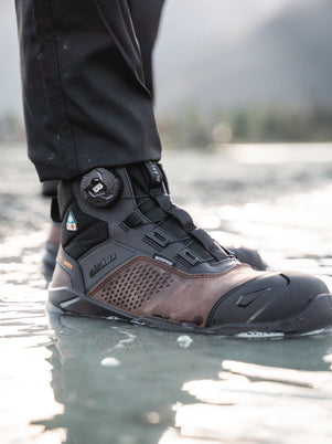 Tradesman wearing the Epic Freelock Safety Boot in Brown/Black
