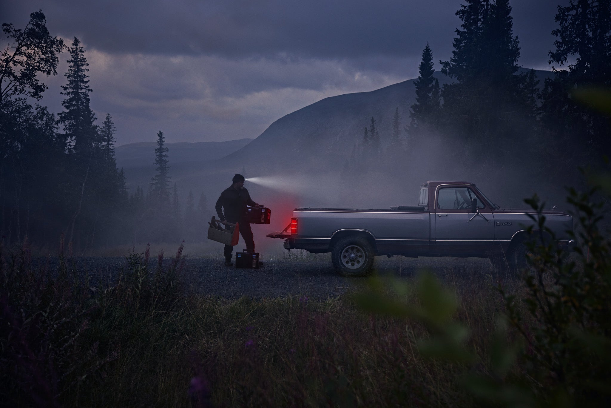 a man in Blaklader Workwear loading his truck at night 